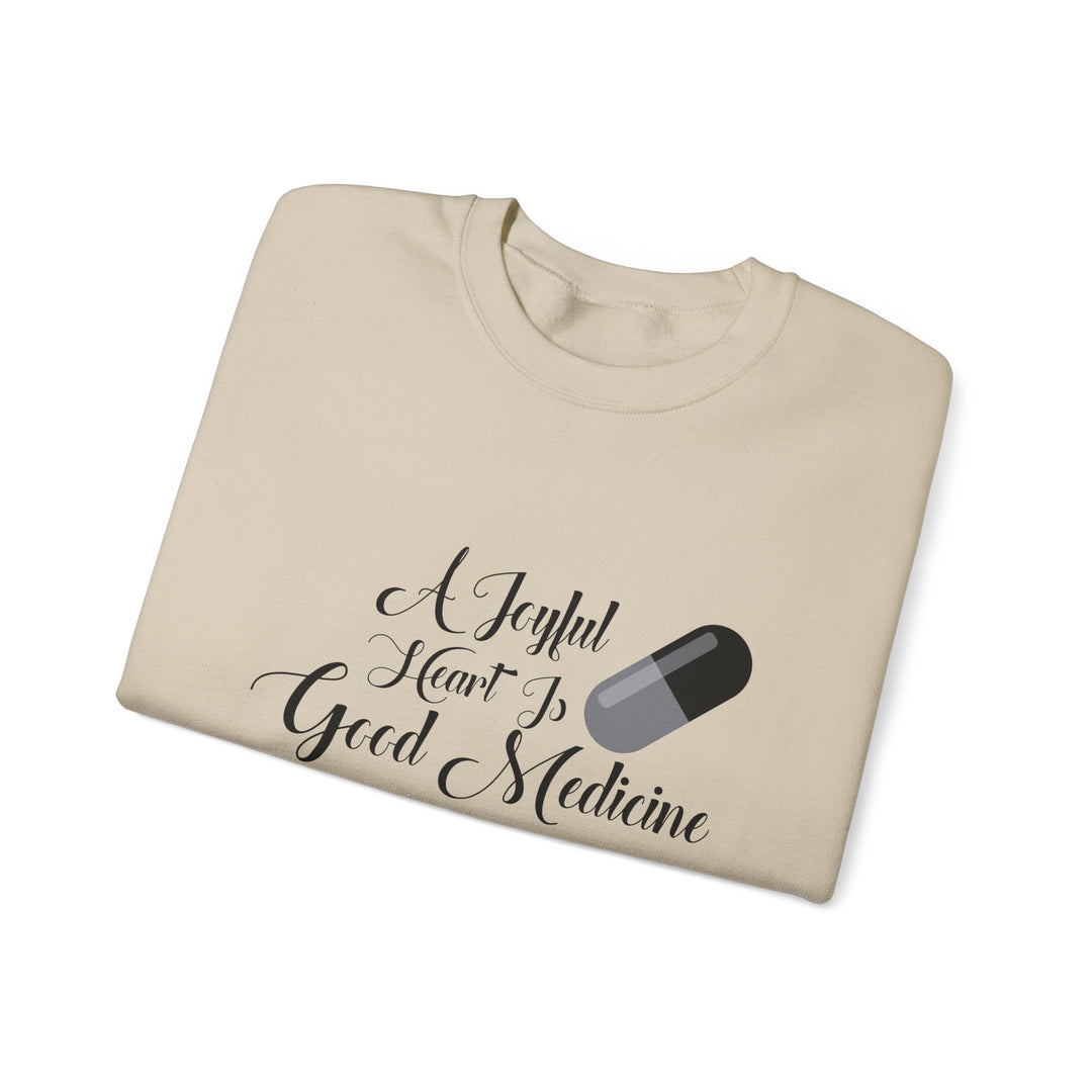 A Joyful Heart Is Good Medicine Unisex Heavy Blend™ Crewneck Sweatshirt