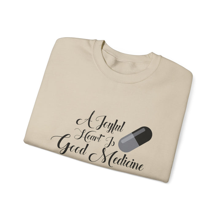 A Joyful Heart Is Good Medicine Unisex Heavy Blend™ Crewneck Sweatshirt
