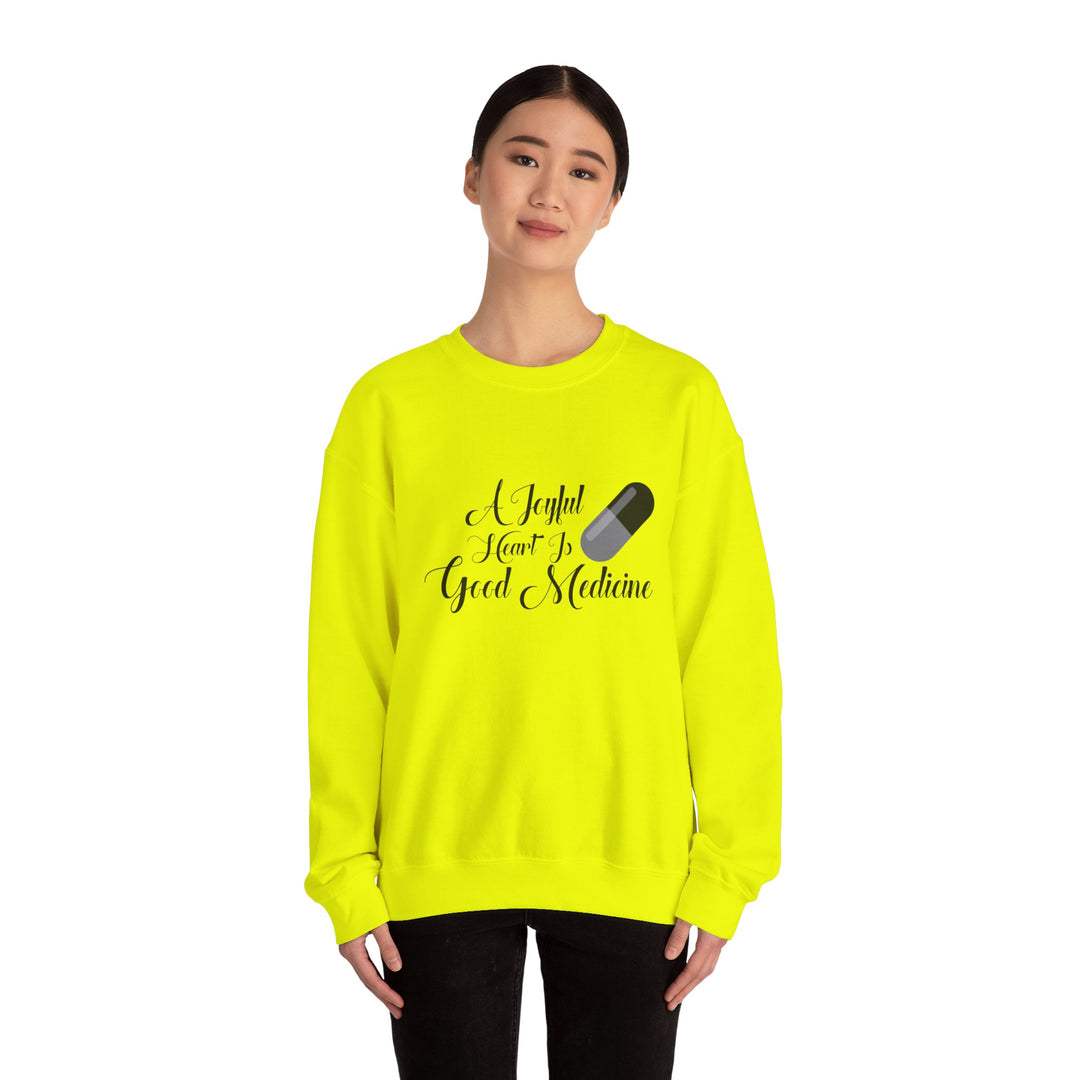 A Joyful Heart Is Good Medicine Unisex Heavy Blend™ Crewneck Sweatshirt