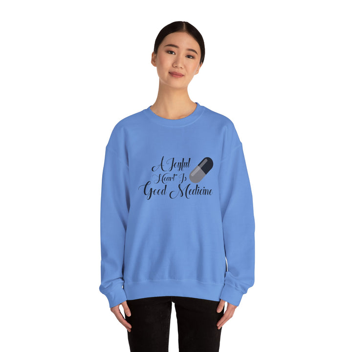 A Joyful Heart Is Good Medicine Unisex Heavy Blend™ Crewneck Sweatshirt