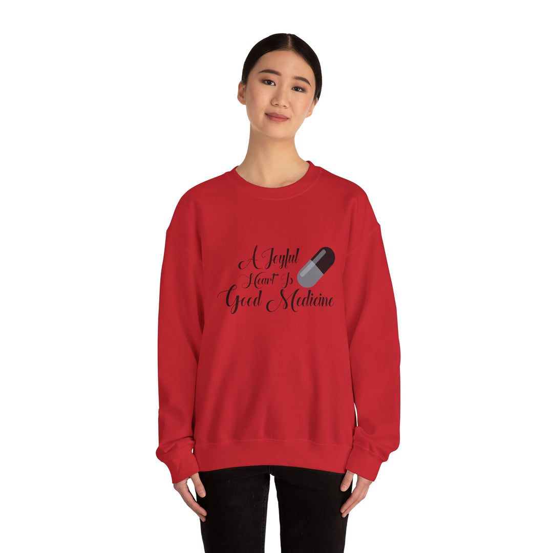 A Joyful Heart Is Good Medicine Unisex Heavy Blend™ Crewneck Sweatshirt