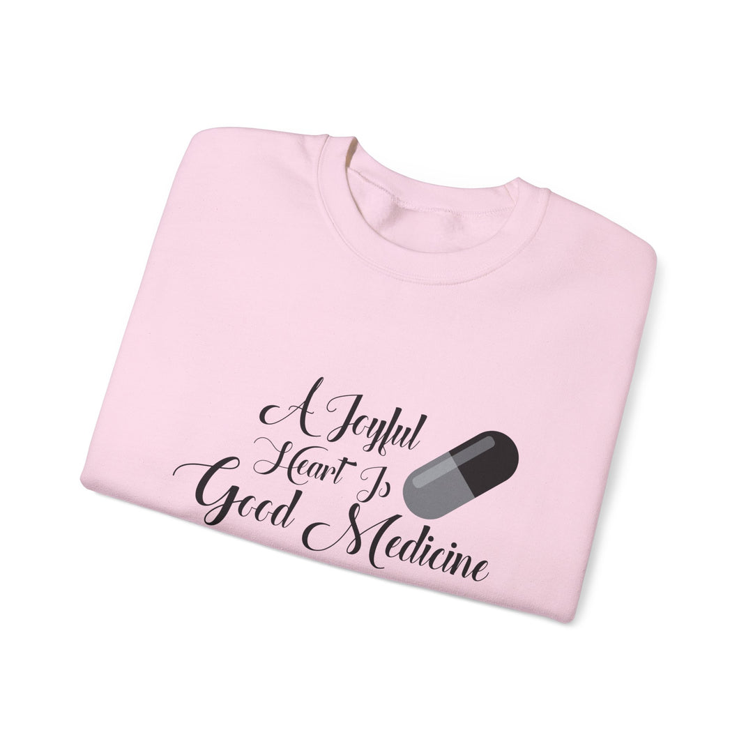 A Joyful Heart Is Good Medicine Unisex Heavy Blend™ Crewneck Sweatshirt