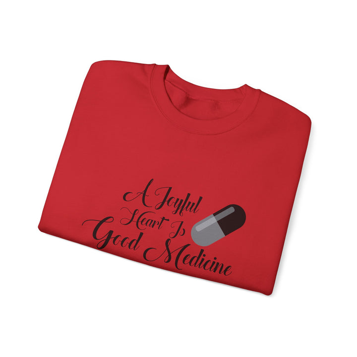 A Joyful Heart Is Good Medicine Unisex Heavy Blend™ Crewneck Sweatshirt