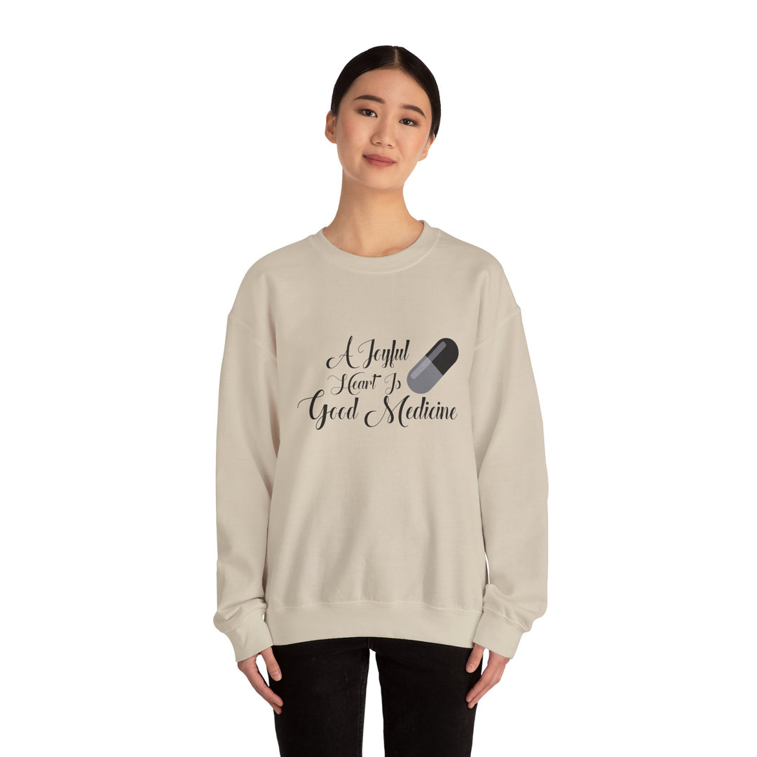 A Joyful Heart Is Good Medicine Unisex Heavy Blend™ Crewneck Sweatshirt