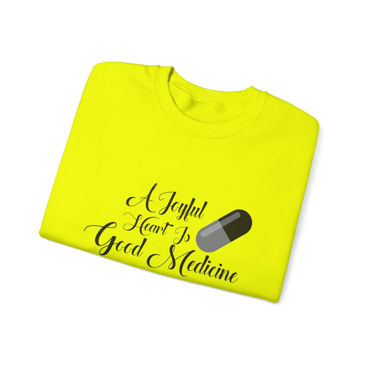 A Joyful Heart Is Good Medicine Unisex Heavy Blend™ Crewneck Sweatshirt - Faith Scripture Gift | Gifts Of Words