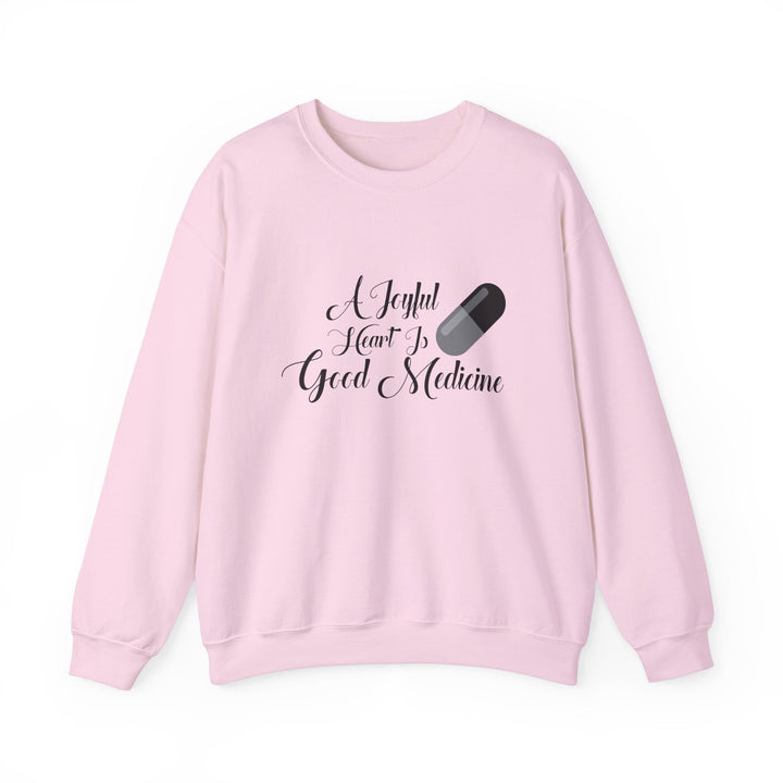 A Joyful Heart Is Good Medicine Unisex Heavy Blend™ Crewneck Sweatshirt - Faith Scripture Gift | Gifts Of Words