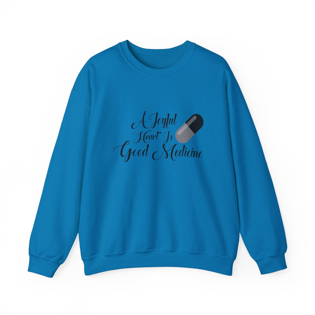 A Joyful Heart Is Good Medicine Unisex Heavy Blend™ Crewneck Sweatshirt - Faith Scripture Gift | Gifts Of Words