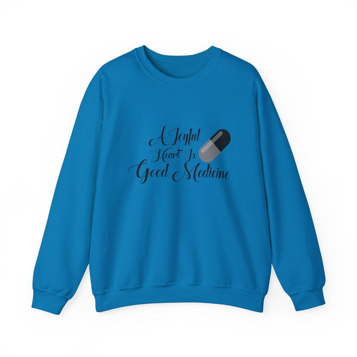 A Joyful Heart Is Good Medicine Unisex Heavy Blend™ Crewneck Sweatshirt - Faith Scripture Gift | Gifts Of Words