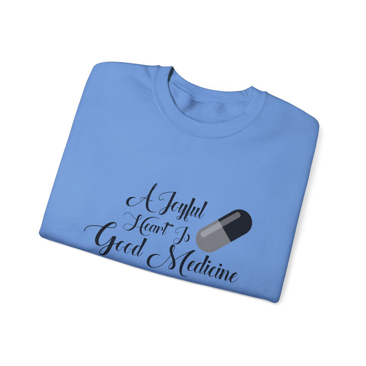 A Joyful Heart Is Good Medicine Unisex Heavy Blend™ Crewneck Sweatshirt - Faith Scripture Gift | Gifts Of Words