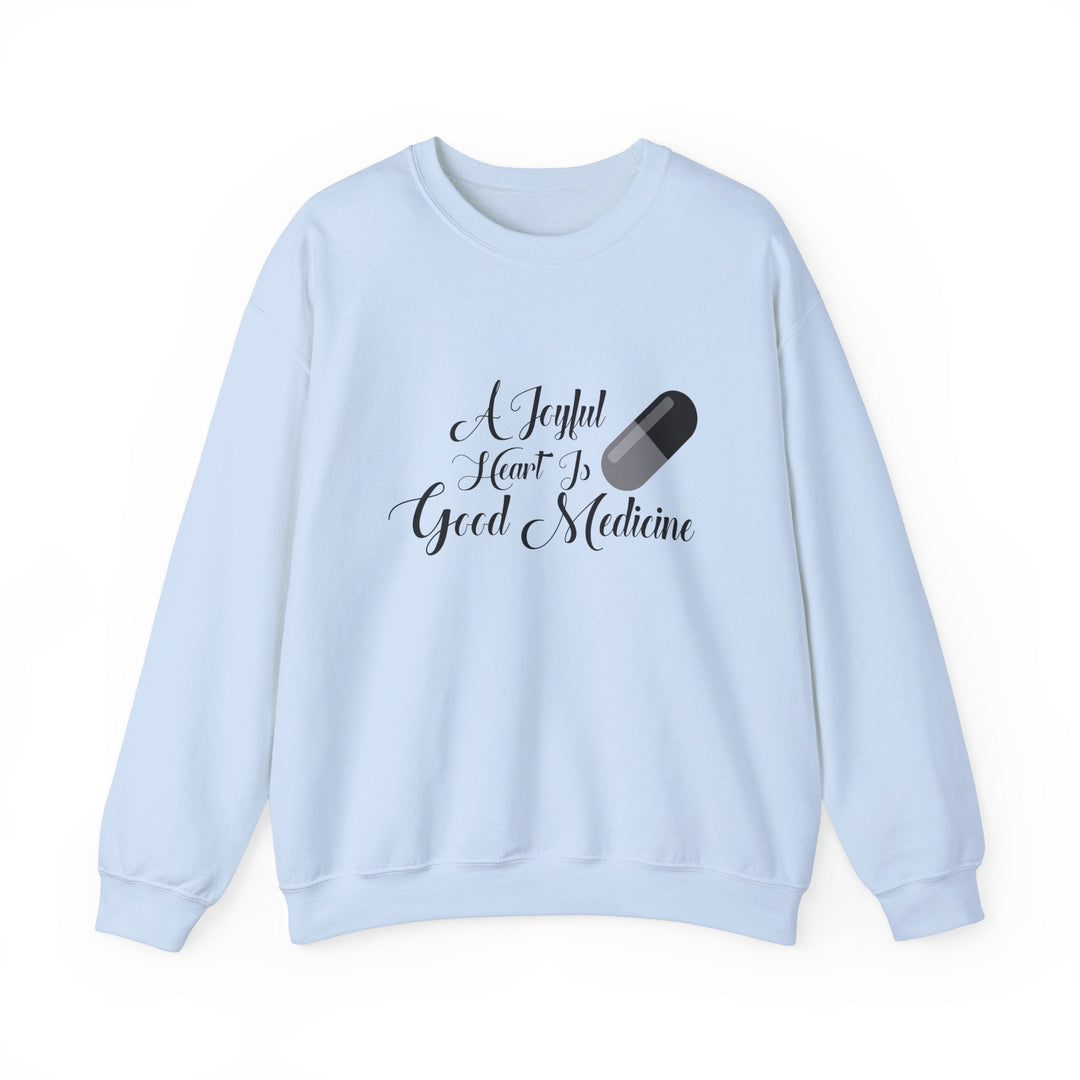 A Joyful Heart Is Good Medicine Unisex Heavy Blend™ Crewneck Sweatshirt - Faith Scripture Gift | Gifts Of Words